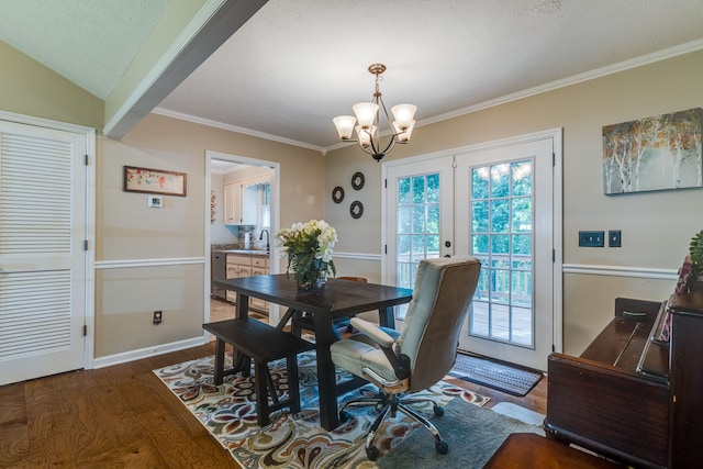 dining space with french doors, dark wood-type flooring, an inviting chandelier, a textured ceiling, and lofted ceiling