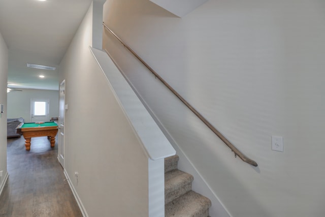 staircase featuring hardwood / wood-style floors and billiards