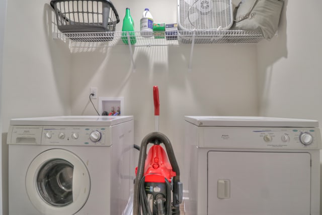 laundry room with washer hookup and washer and clothes dryer