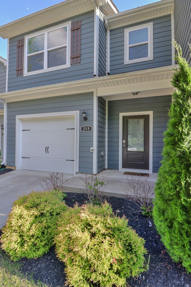 view of front of property with a garage