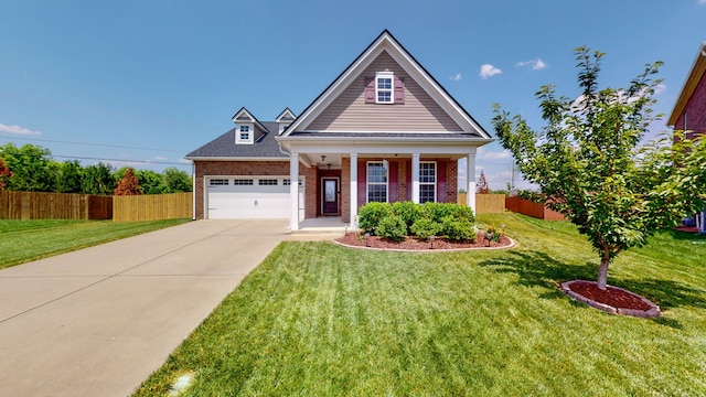 view of front of property with a front yard and a garage