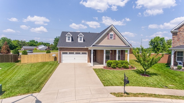 view of front of house featuring a front yard and a garage