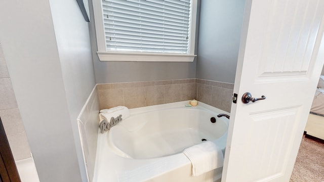 bathroom featuring a bath to relax in