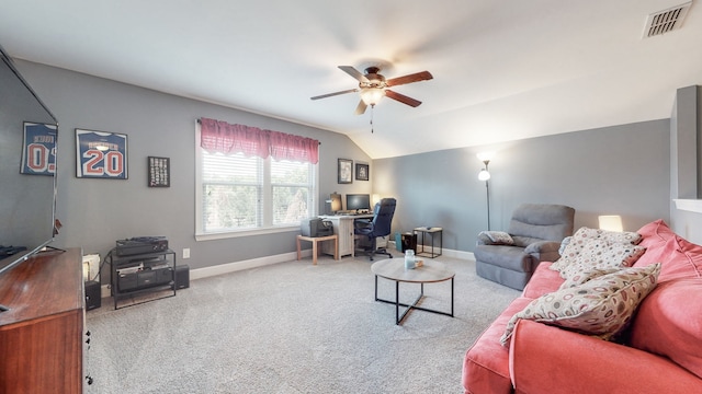 carpeted living room featuring ceiling fan and vaulted ceiling