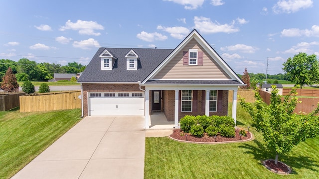 view of front facade featuring a front yard and a garage