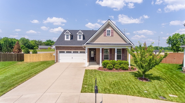 view of front of property featuring a front lawn and a garage