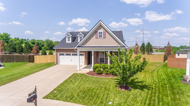 view of front of property featuring a front yard and a garage