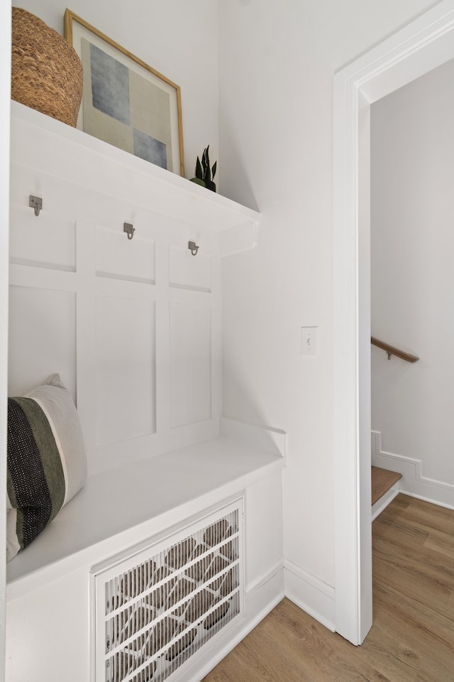 mudroom with wood-type flooring