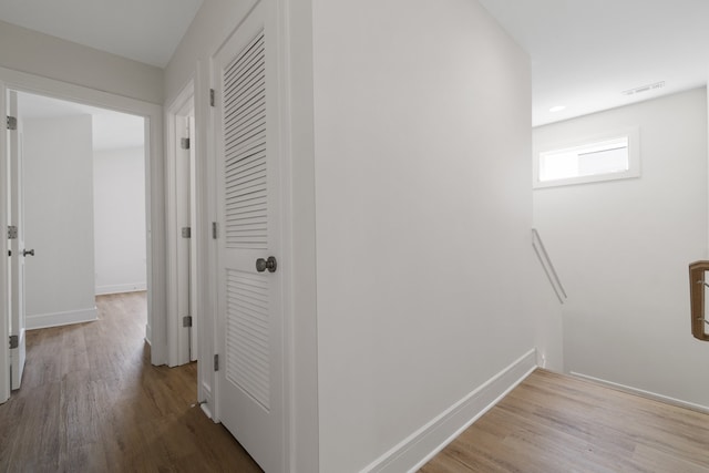 hall with light wood-type flooring