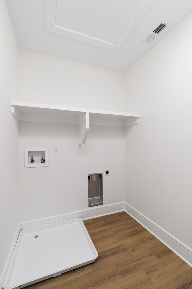 laundry room with dark wood-type flooring, hookup for an electric dryer, and hookup for a washing machine