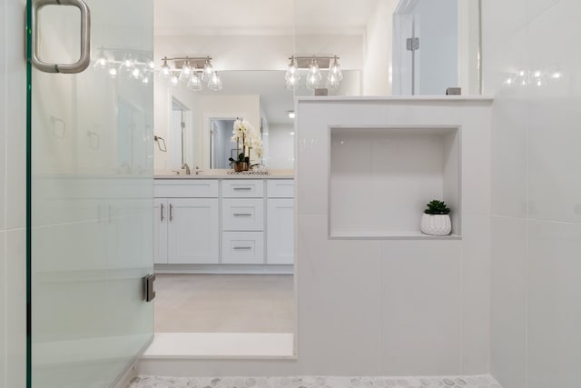 bathroom with vanity, walk in shower, and tile floors