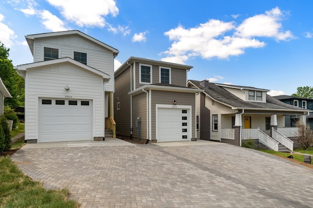 view of front of property featuring covered porch and a garage