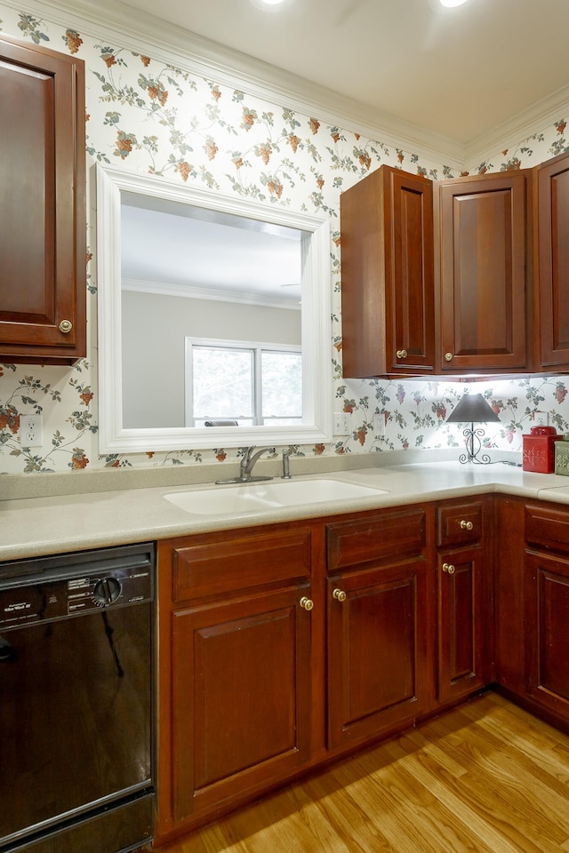 kitchen featuring crown molding, sink, black dishwasher, and light hardwood / wood-style floors