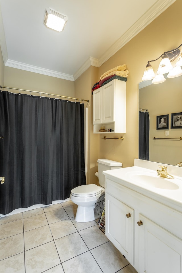 bathroom with toilet, large vanity, ornamental molding, and tile flooring