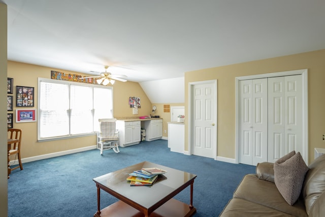 living room with ceiling fan, dark carpet, and lofted ceiling