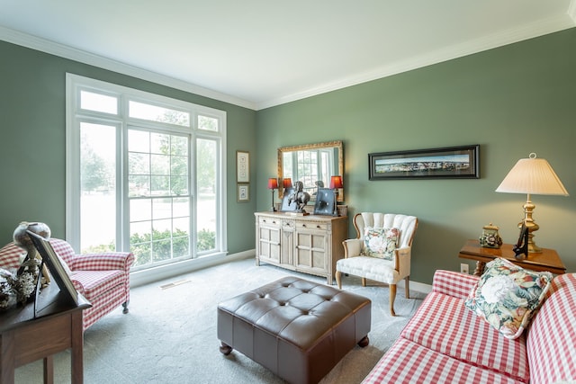 sitting room featuring ornamental molding and light colored carpet