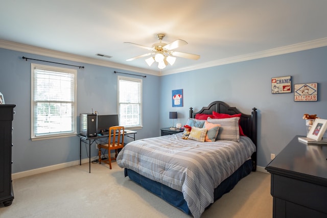 carpeted bedroom with ceiling fan and crown molding