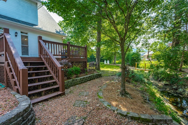 view of yard with a wooden deck