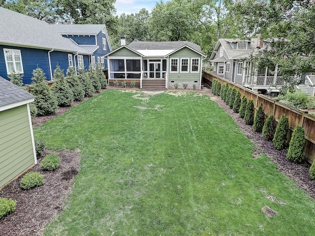 view of yard with a sunroom