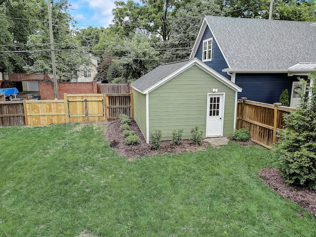 back of property with a lawn