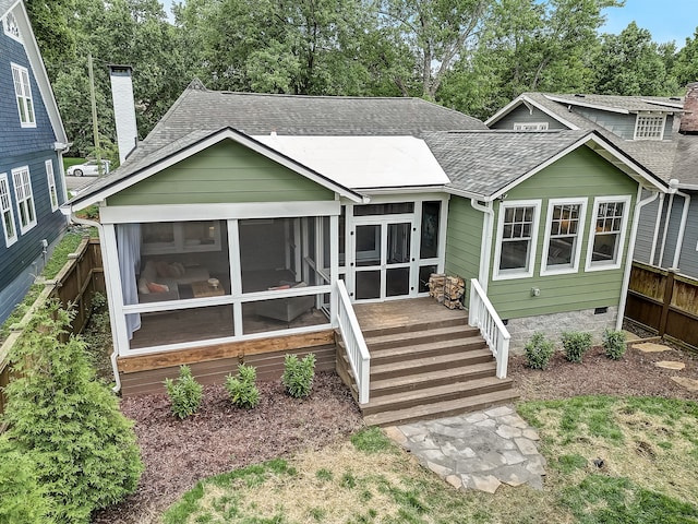 view of front of property with a sunroom