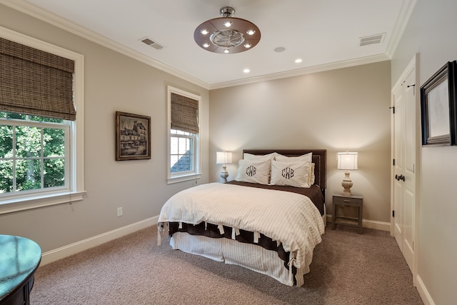 carpeted bedroom with ornamental molding