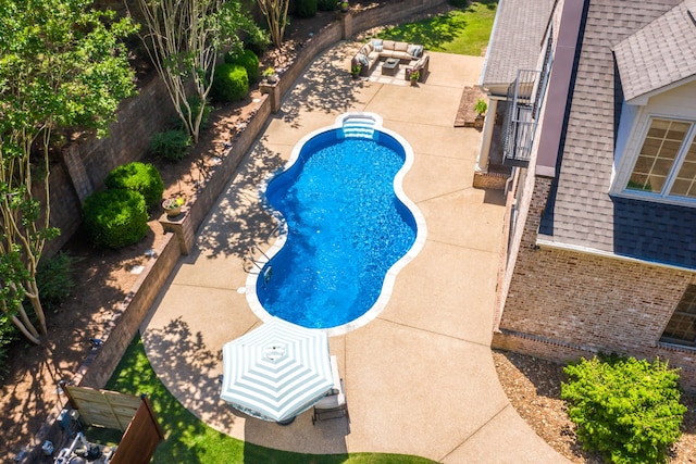 view of swimming pool featuring a patio