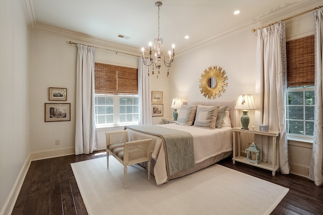 bedroom featuring ornamental molding, a notable chandelier, and dark hardwood / wood-style floors