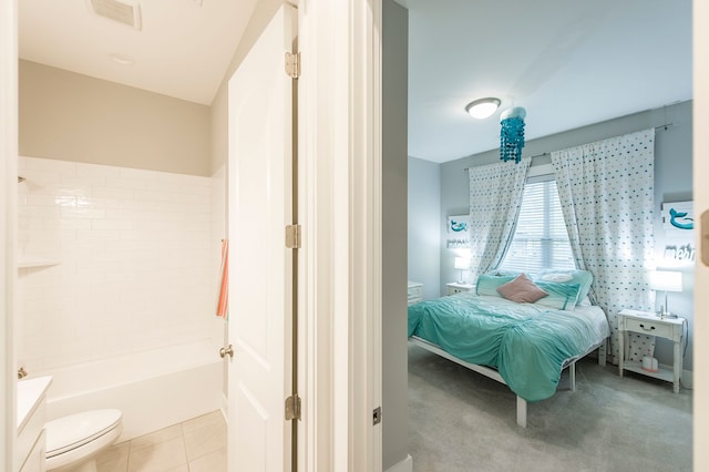 bedroom with light tile floors