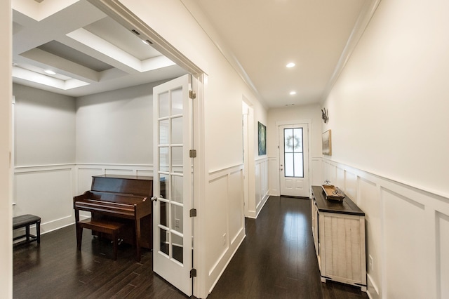 hallway with crown molding, dark hardwood / wood-style floors, and french doors