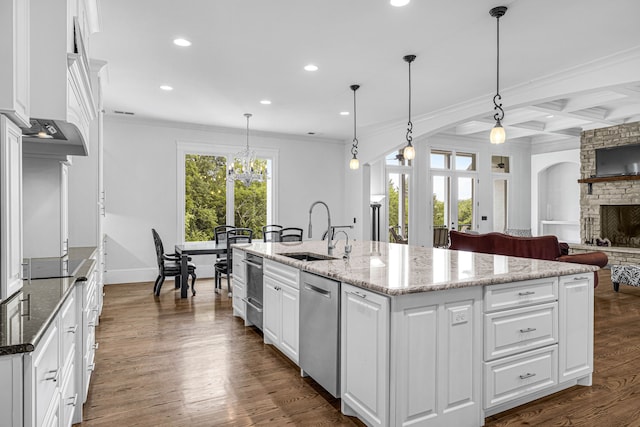 3609 Leipers Valley Trl, Franklin, TN 37064 - kitchen featuring pendant lighting, a stone fireplace, a kitchen island with sink, and sink