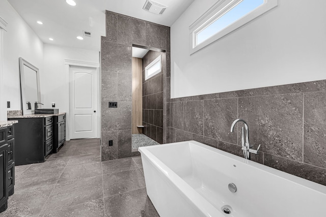 3609 Leipers Valley Trl, Franklin, TN 37064 - bathroom with plus walk in shower, tile walls, vanity, and tile floors
