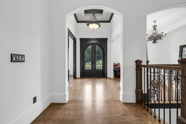 3609 Leipers Valley Trl, Franklin, TN 37064 - foyer entrance with ornamental molding, a notable chandelier, a raised ceiling, and light wood-type flooring