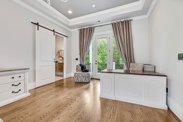 3609 Leipers Valley Trl, Franklin, TN 37064 - unfurnished bedroom with a raised ceiling, a barn door, light hardwood / wood-style floors, and ornamental molding