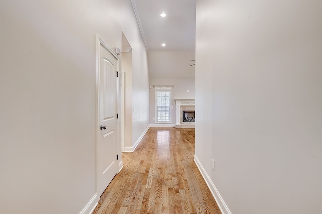 hallway with light hardwood / wood-style flooring