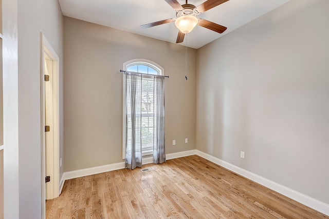 unfurnished room featuring ceiling fan and light wood-type flooring