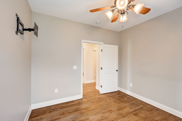 empty room featuring ceiling fan and light wood-type flooring