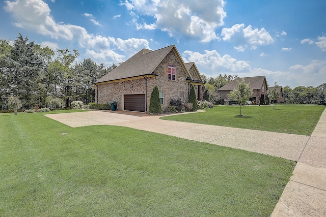 view of front of house featuring a front yard and a garage