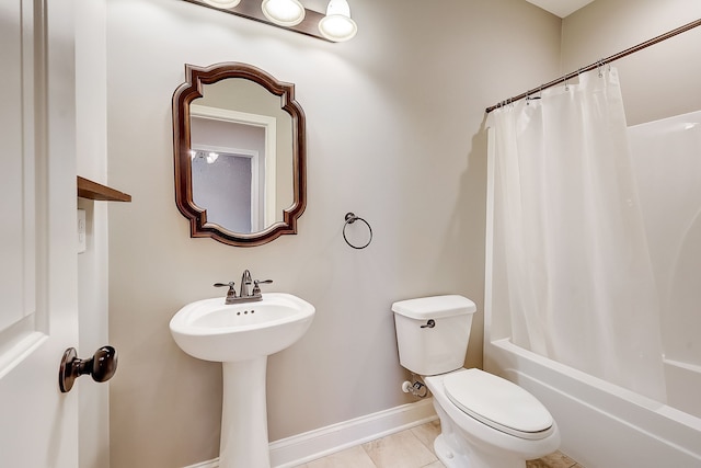 bathroom featuring toilet, shower / tub combo with curtain, and tile flooring