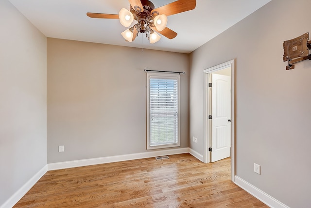 unfurnished room featuring ceiling fan and light wood-type flooring