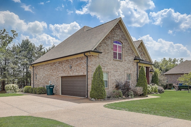 exterior space with a yard and a garage