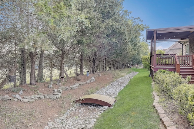 view of yard featuring a wooden deck