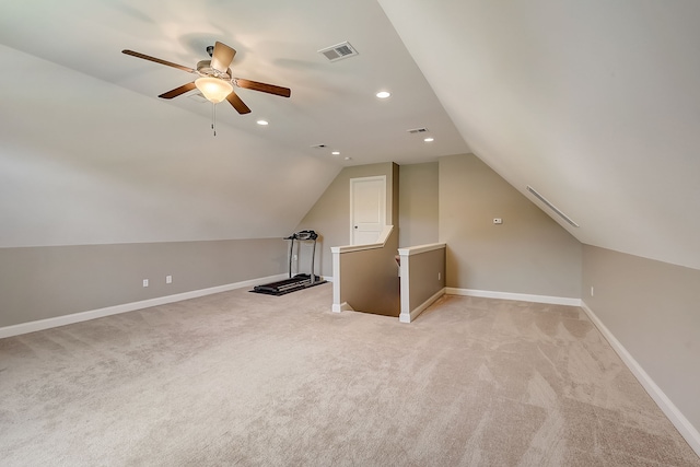 additional living space featuring light carpet, ceiling fan, and vaulted ceiling