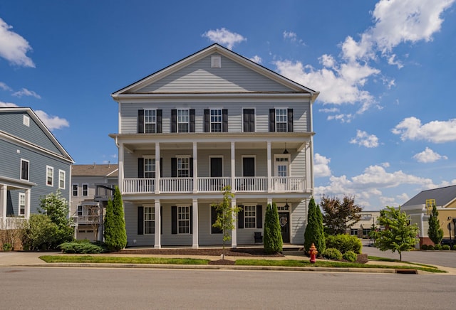 greek revival house featuring a porch