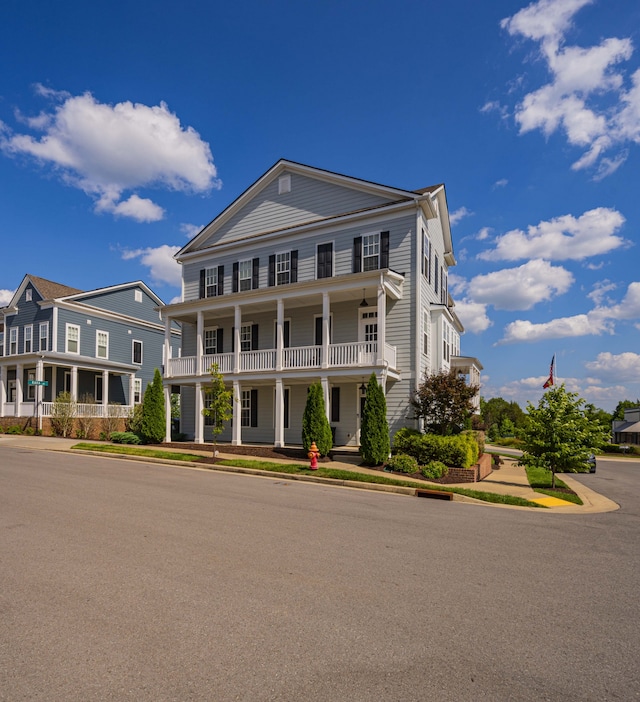 greek revival inspired property with covered porch