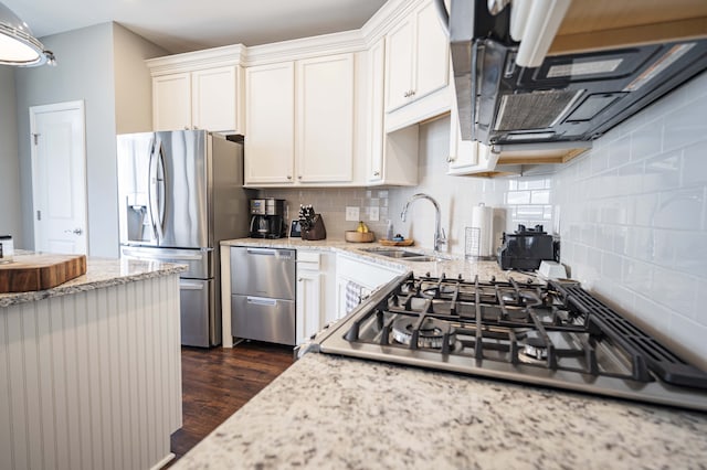 kitchen featuring stainless steel fridge with ice dispenser, light stone countertops, dark wood-type flooring, tasteful backsplash, and white cabinetry