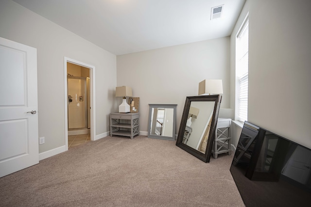 living area with dark colored carpet