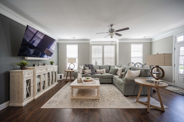 living room with crown molding, dark hardwood / wood-style floors, ceiling fan, and a wealth of natural light