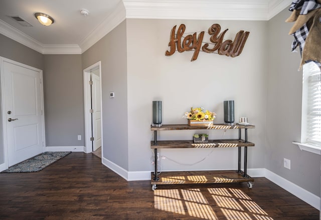 entryway featuring dark hardwood / wood-style floors and ornamental molding