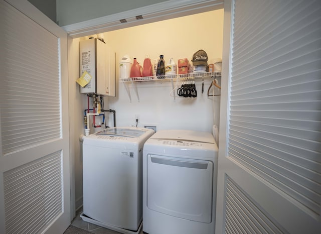 laundry room with washing machine and dryer, washer hookup, and water heater